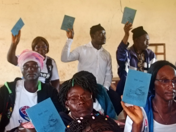 people holding their books of Jonah